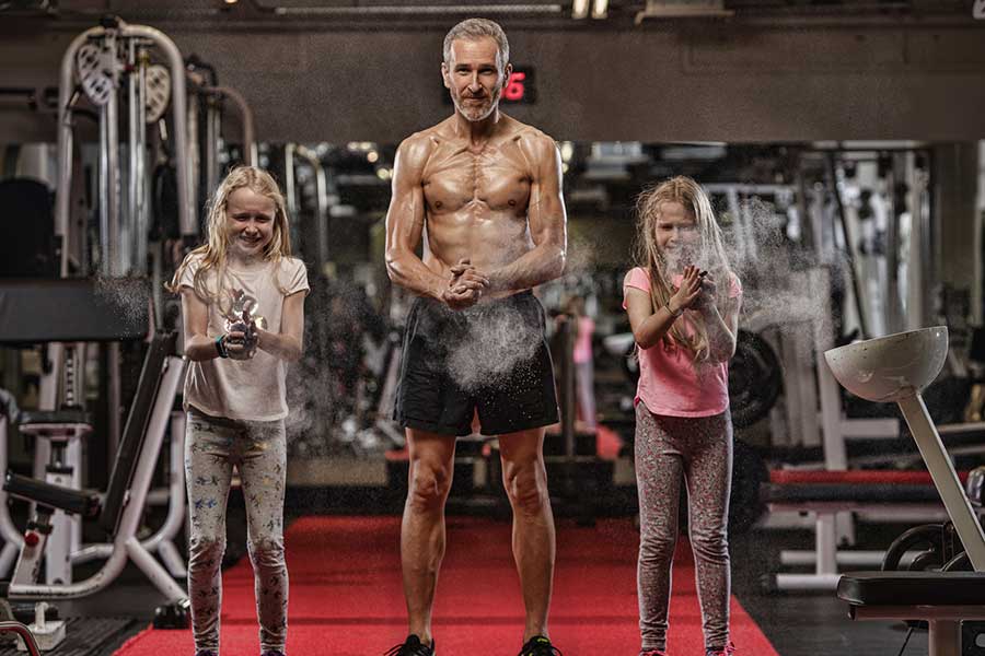 Daniel-in-the-gym-with-daughters | Ultimate Performance | Ultimate Performance